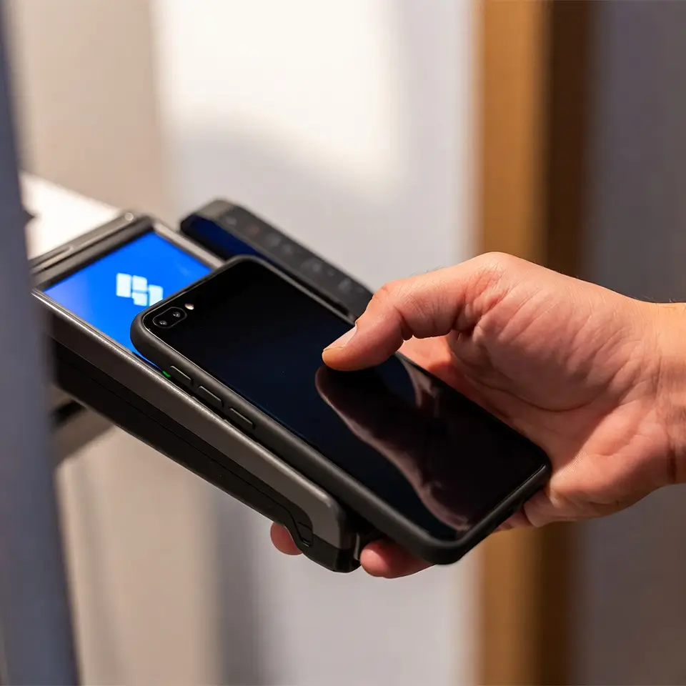 Customer using a payment terminal, illustrating the expansion of UnionPay in Brazil and local market integration.